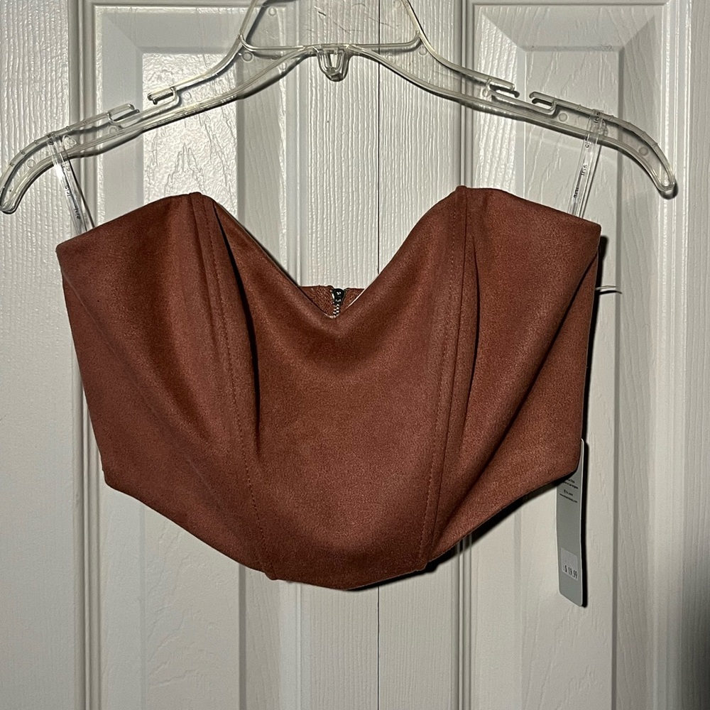 A salmon color crop top. Size S (but was too big to fit my chest area).